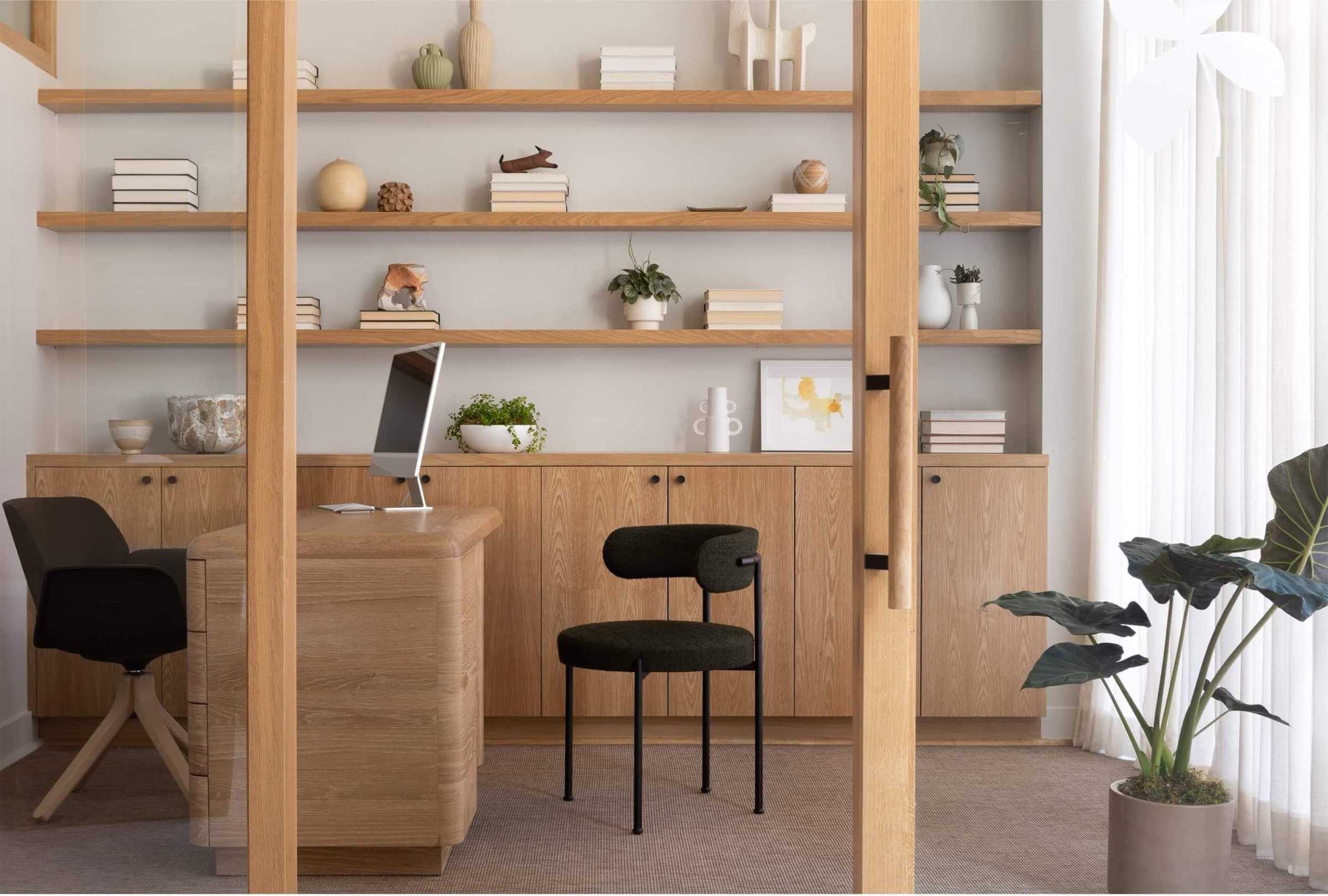 Clover interior detail — layered woods, greenery, and diffuse light